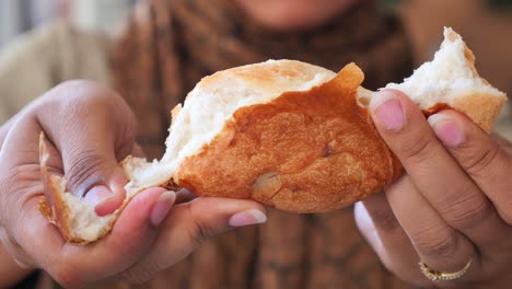 person eating bread