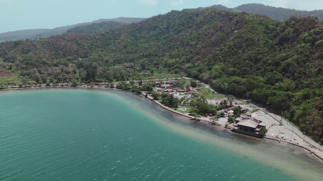 From above, a drone reveals the scenic Chaguaramas boardwalk and Williams Bay on Trinidad's Caribbean coast.