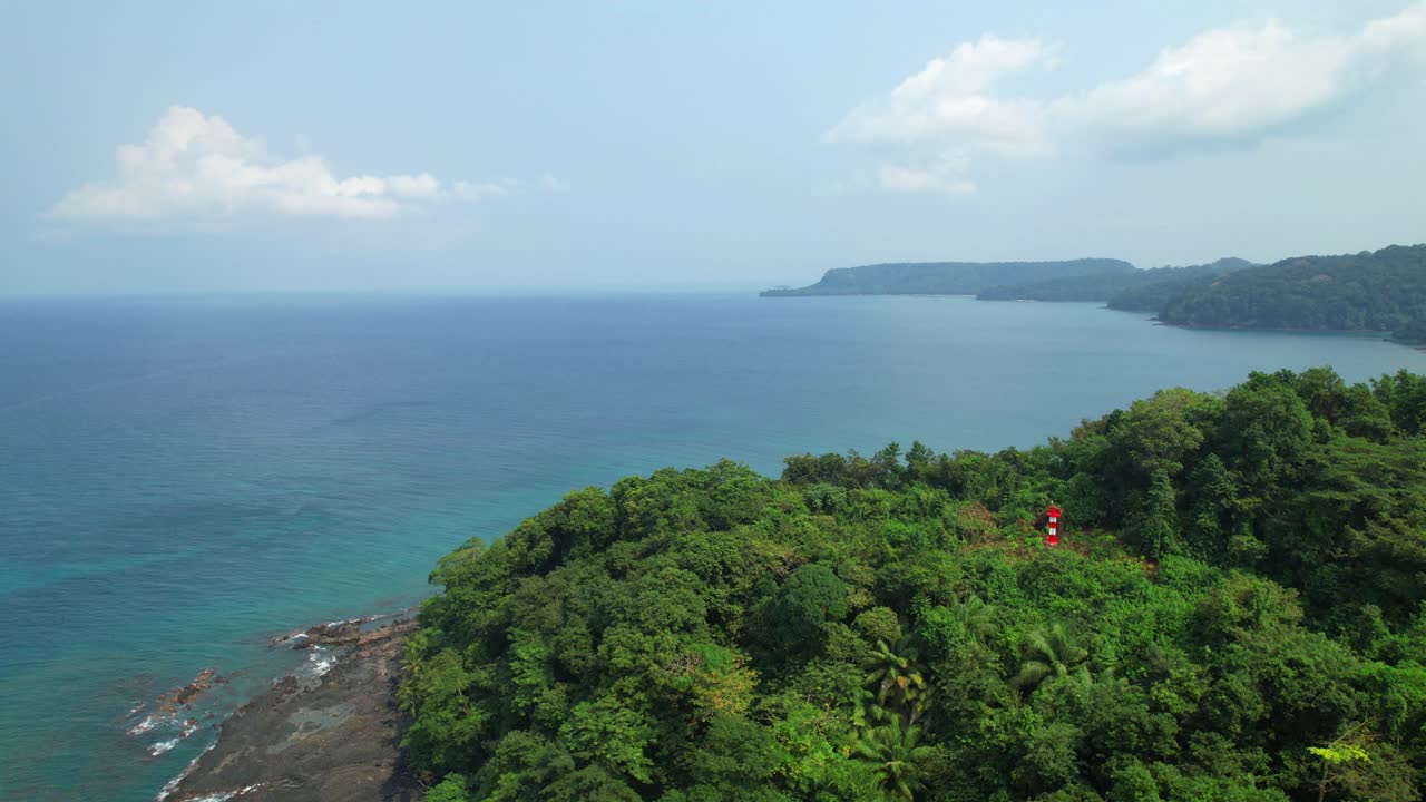 Circular view of the lighthouse located at the top of the Bom Bom islet revealing the coast of the island. Ilha do Principe (prince Island) Africa
