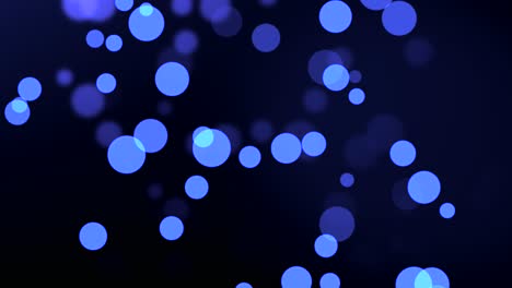 animation of blue particle circles moving on bokeh background