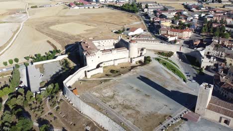 aerial-view-from-top-of-medieval-castle,-defensive-walls,-main-square-and-traditional-houses