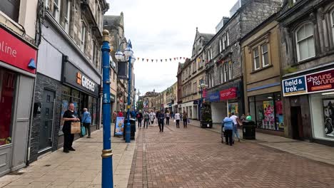 people walking and shopping in dunfermline, scotland