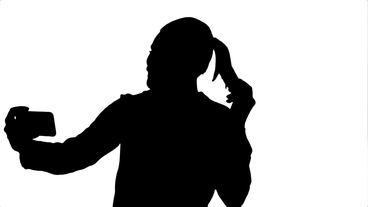 Silhouette Businesswoman taking funny selfie with phone