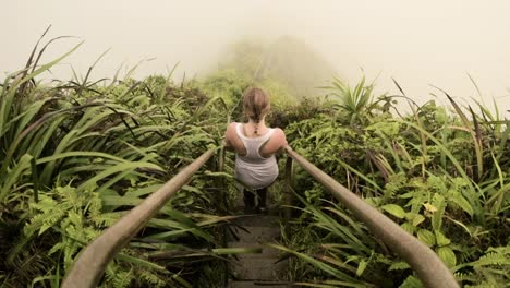 girl-walking-down-stairs---stairway-to-heaven-in-Oahu,-Hawaii