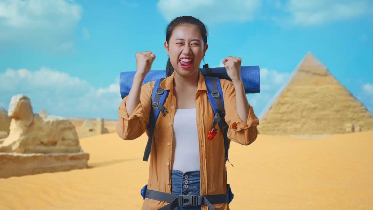 Asian Female Hiker With Mountaineering Backpack Screaming Goal Celebrating The Success While Traveling In Pyramid Of Giza