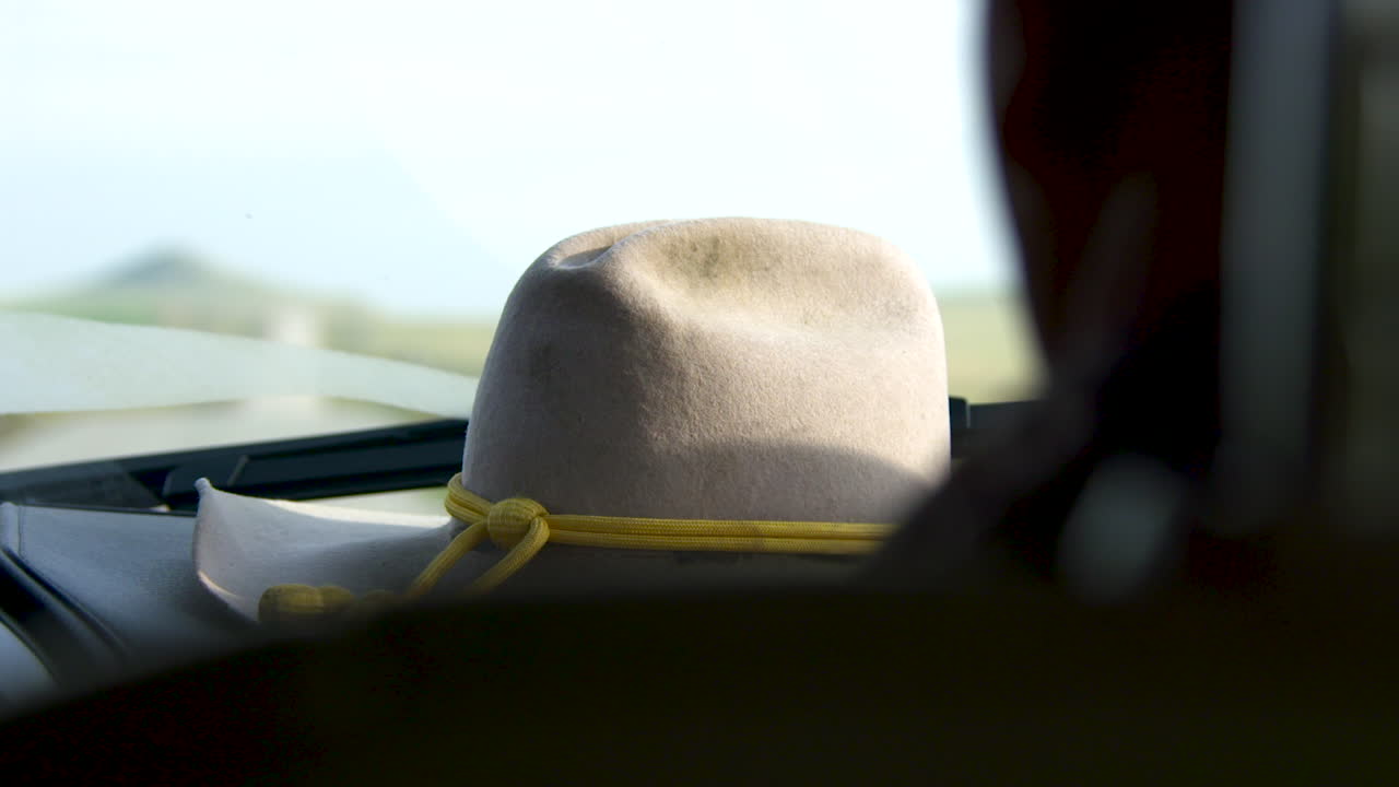 Cowboy hat on a dashboard