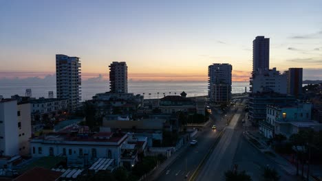 beautiful aerial time lapse view of the residential neighborhood in the havana city, capital of cuba, during a vibrant, colorful and cloudy sunrise