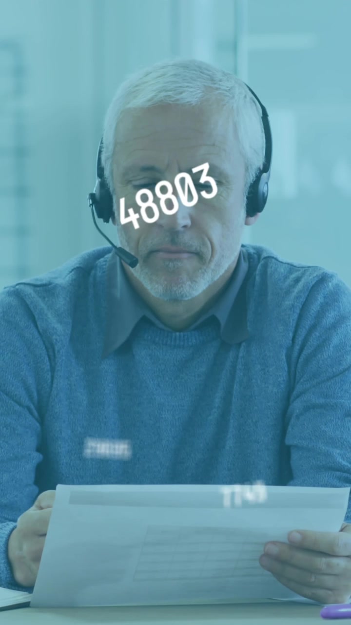 Animation of numbers floating with man going through paperwork in an office