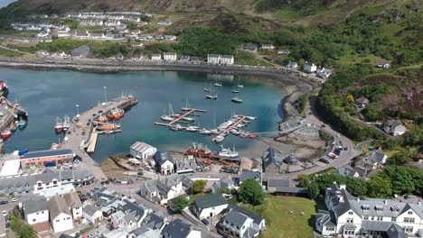 panning drone shot of scottish harbour town