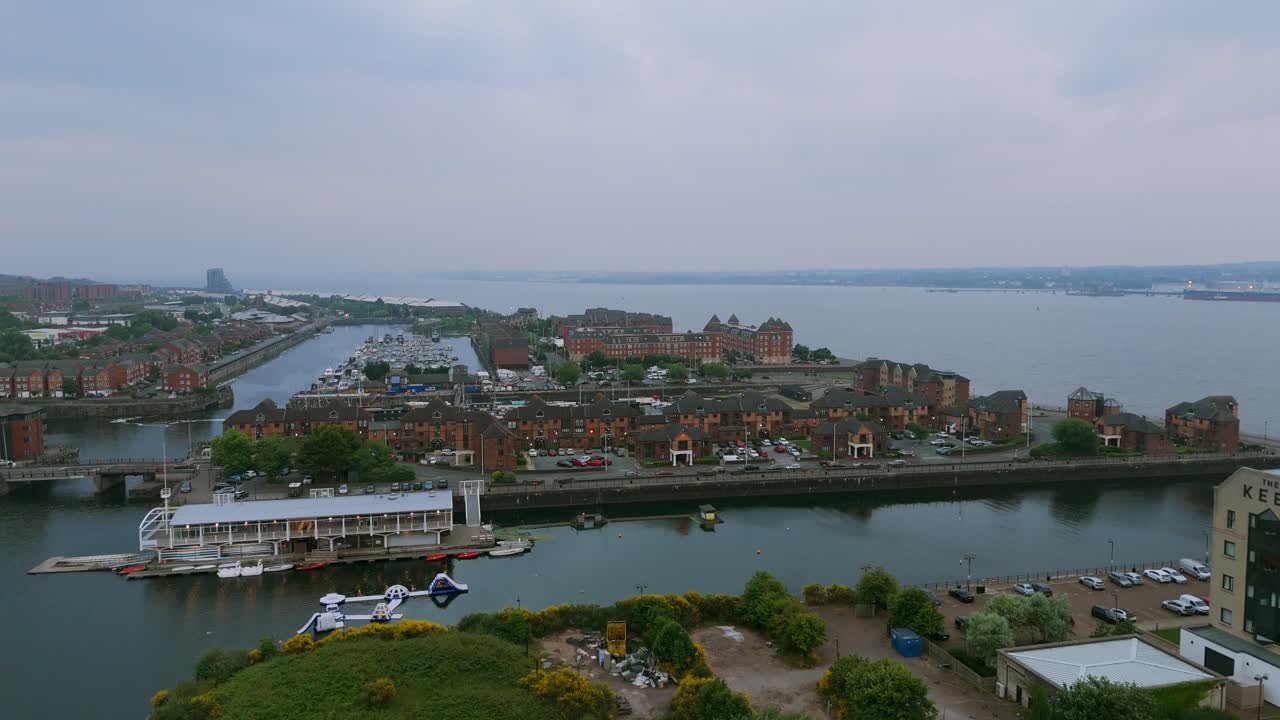 Aerial view of Liverpool's historic docks, showcasing the blend of urban development and maritime heritage along the River Mersey