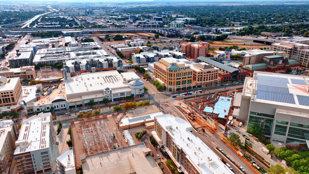 Salt Lake City, USA, 14 August 2025: Vast urban area of a vibrant Salt Lake City, Utah, USA. View on the lively traffic by the highways of the city at backdrop. Aerial perspective