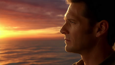 man gazing at a beautiful sunset over the ocean