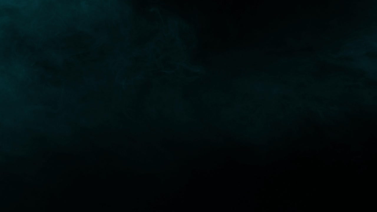 Gentle waves of cyan vapor and mist create a mysterious and atmospheric abstract background on black background