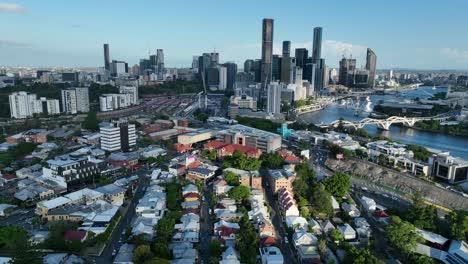 aerial drone shot flying around petrie terrace suburb, with breathtaking views of brisbane river, brisbane city, south bank, west end, roma st station, and many of brisbane's bridges in shot