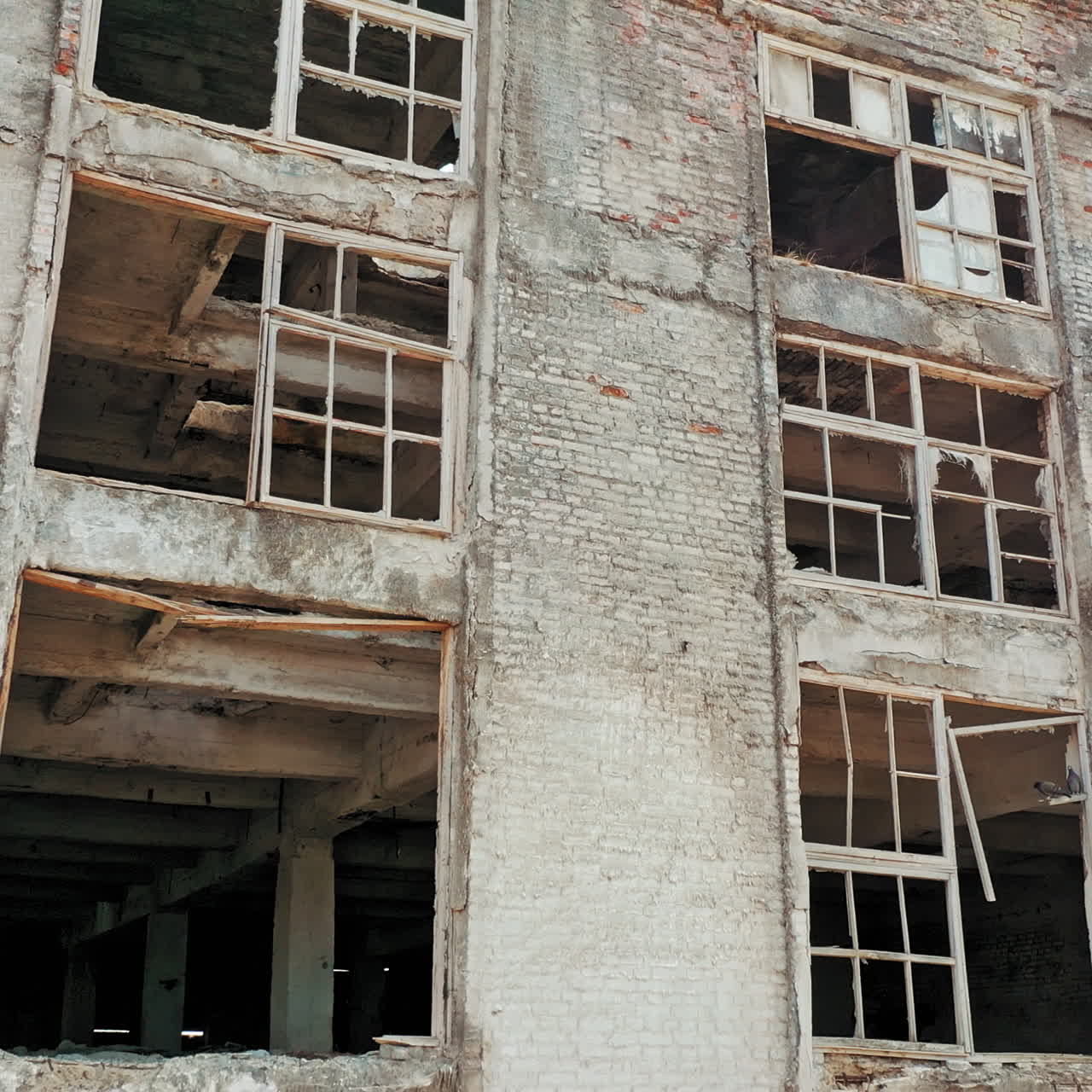Old industrial building for demolition. Abandoned building exterior. Aerial view.