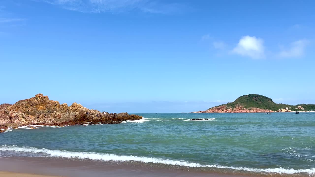 Handheld shot over beautiful wide open tropical sand beach