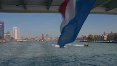 Onboard-a-cruising-ship,-sailing-under-a-bridge