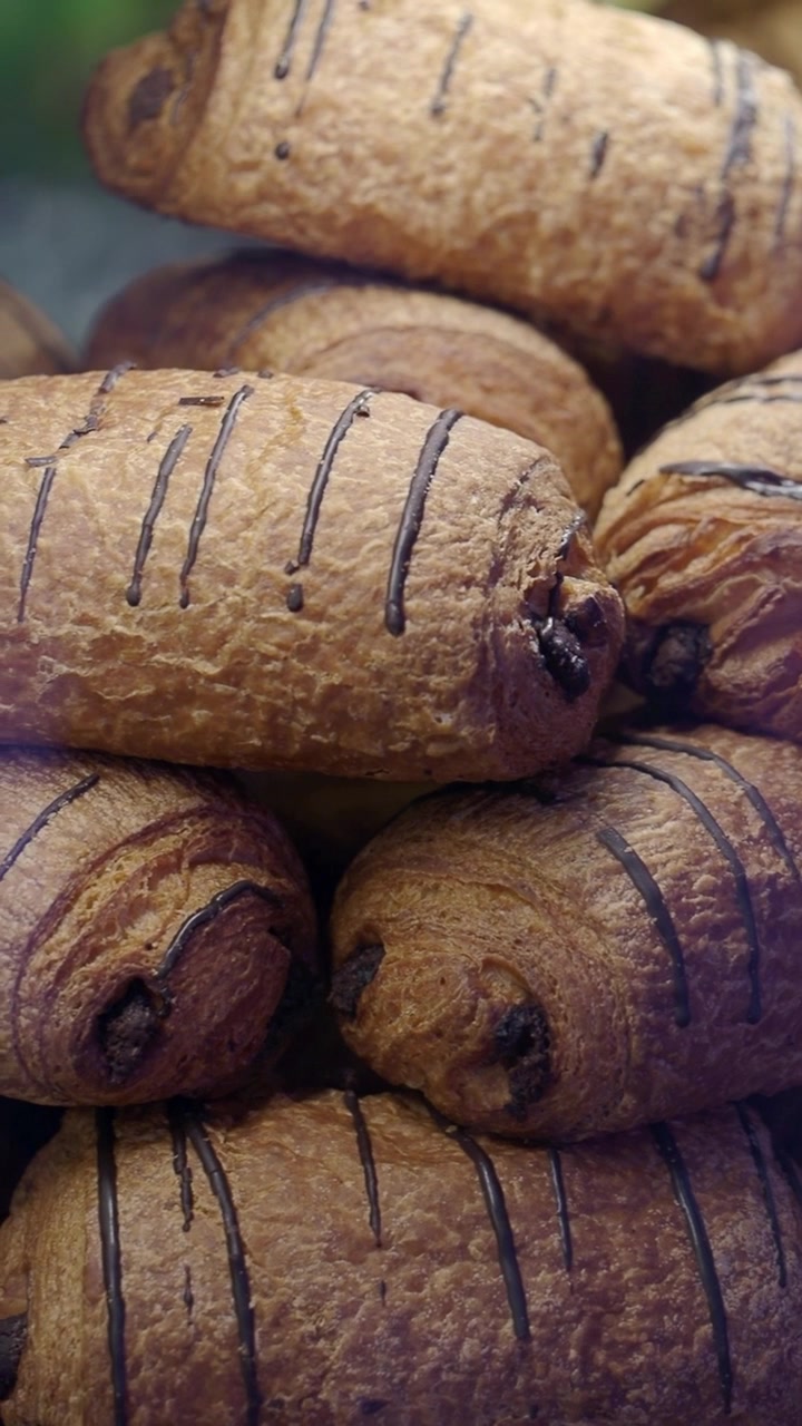 Freshly Baked Chocolate Croissants Displayed in a Bakery