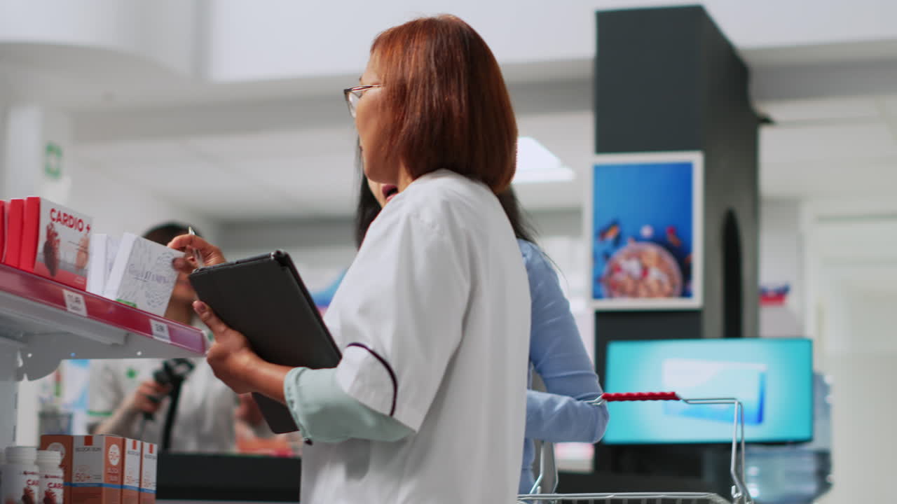 Pharmacist assisting customer in pharmacy