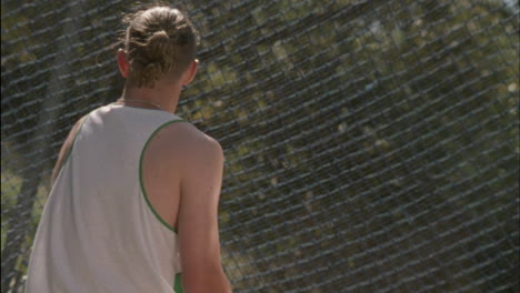 a young man throws a disc