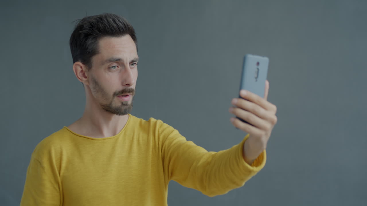 Man Taking a Selfie with a Smartphone