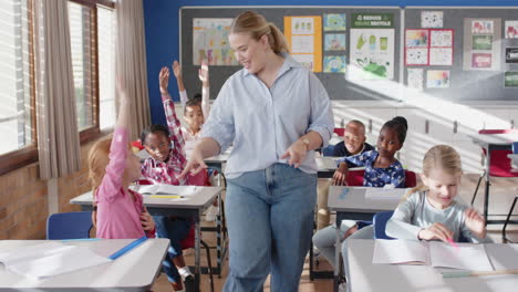 in school, female teacher interacting with students in classroom, engaging in discussion