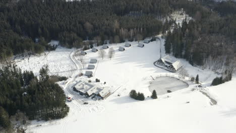 aerial shot of a winter ski camp with mountain landscape in zubri, czech republic