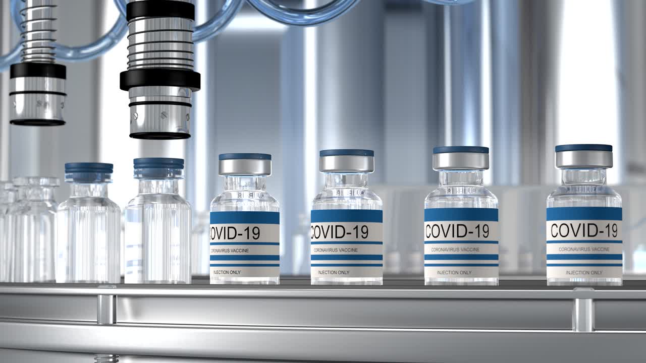 SARS-COV-2 COVID-19 Mass production of coronavirus vaccine, a machine pours the vaccine, seals bottle caps into ampoules moving along a pharmaceutical conveyor belt in a research laboratory