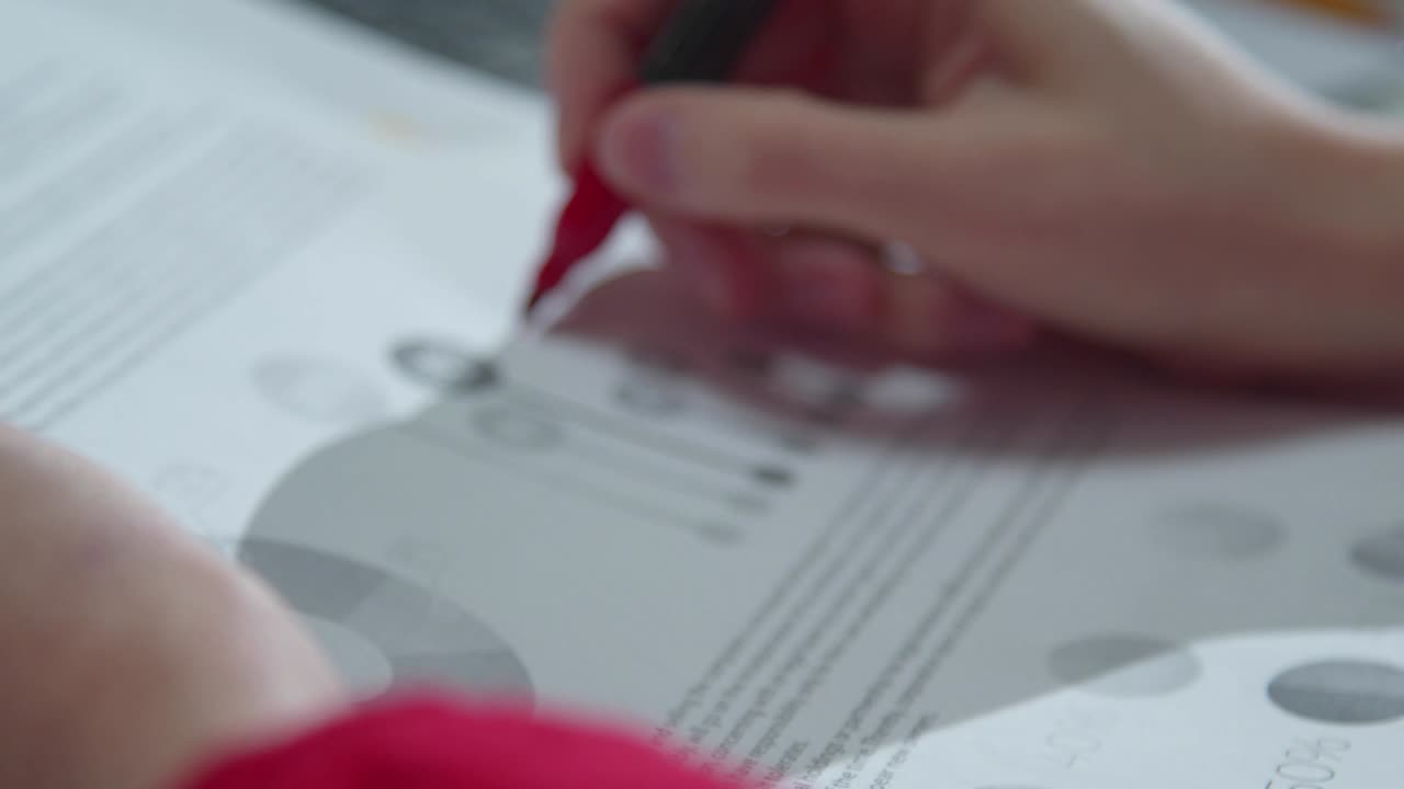 Woman puts marks in documents with marker
