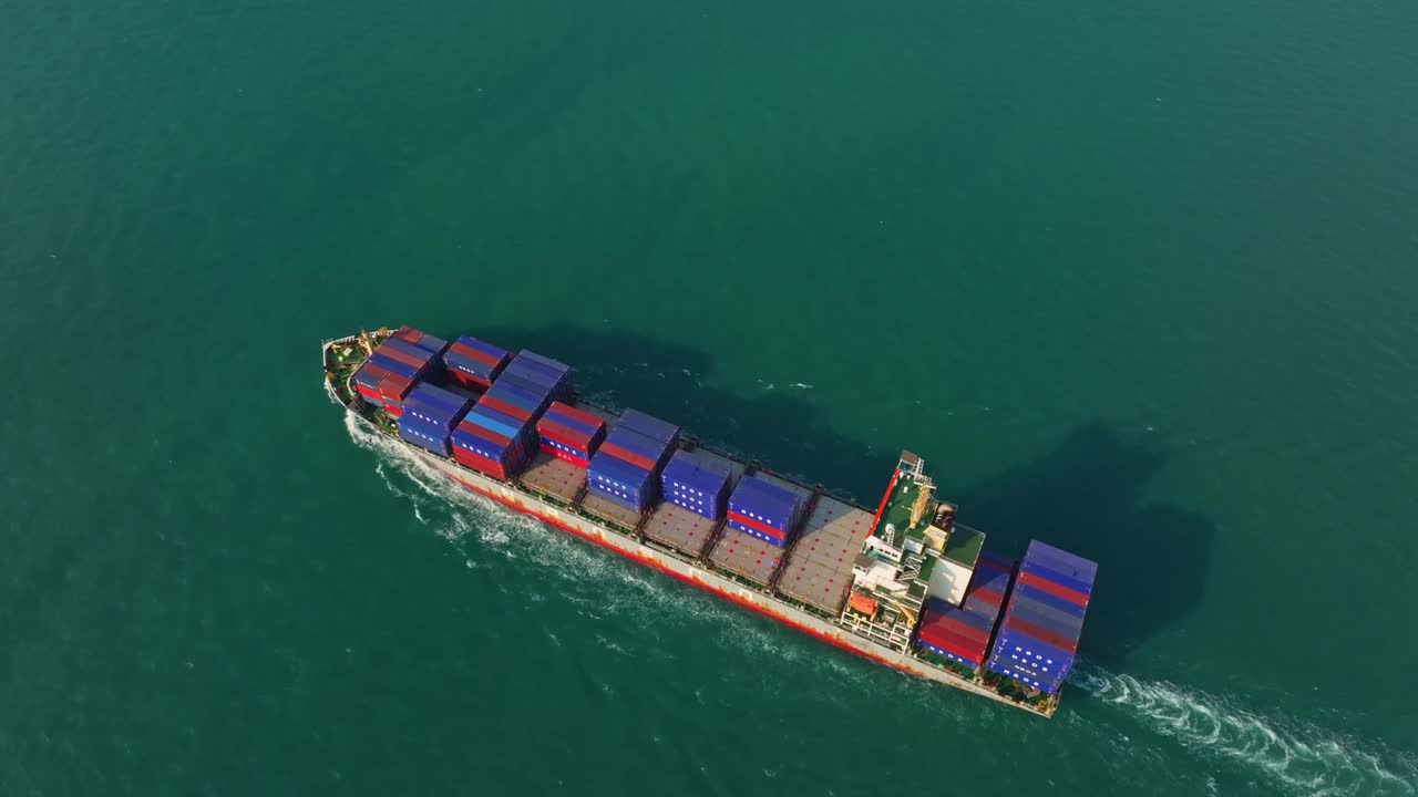 Loaded container ship navigating deep waters, Thailand
