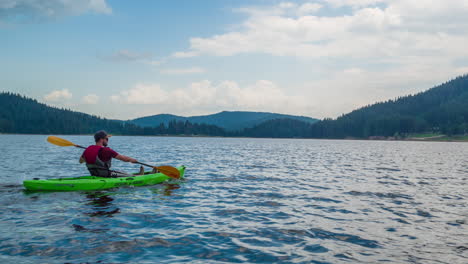 kayaking solo on a serene lake under