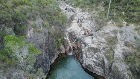 aerial forward view over waterfall portela do homem