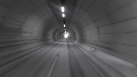 car rides through the tunnel point-of-view driving. light at the end of the tunnel.