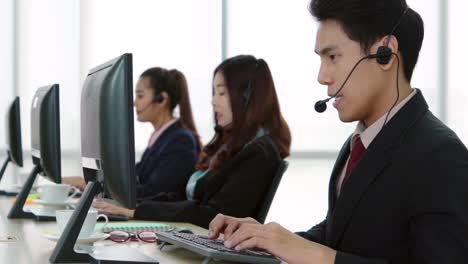 business people wearing headset working in office