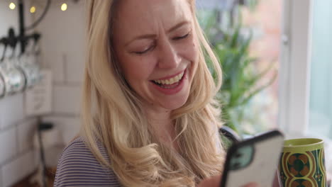 woman using phone and drinking from mug