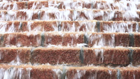 Water-falls-down-in-cascade-fountain