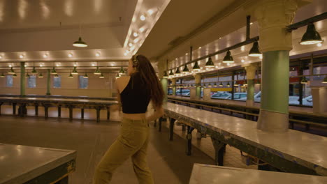 young, female, contemporary dancer in urban market after hours