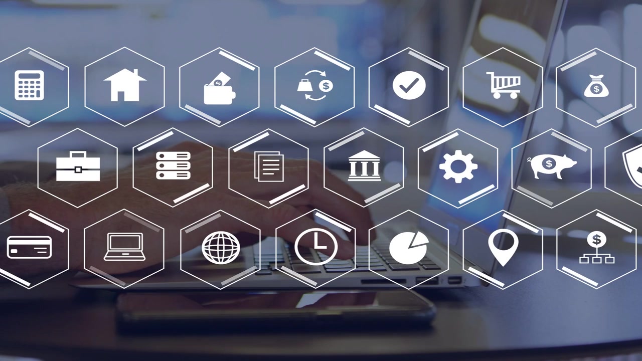 Male hands typing on laptop, starting hex icon grid forming finance UI while phone staying still