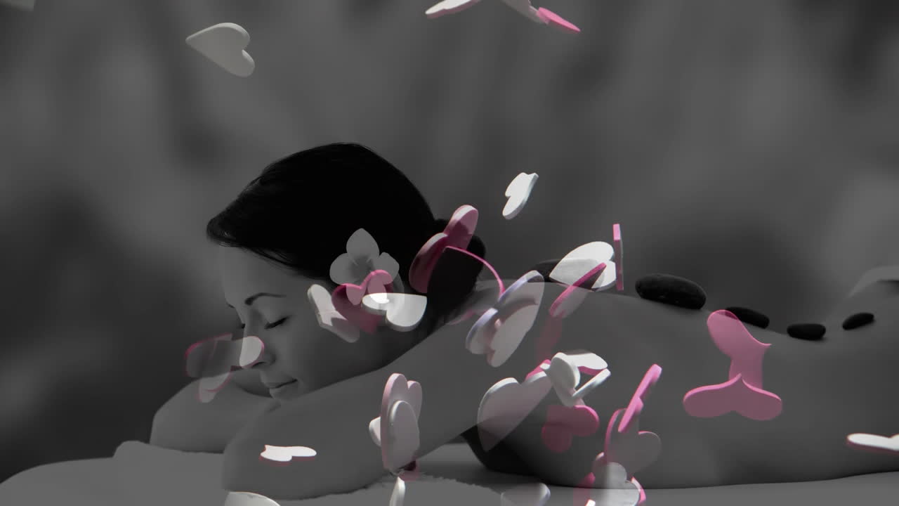 뜨거운 돌 마사지를 받는 편안한 여성, 장면 위에 떠다니는 심장의 애니메이션