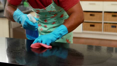 man cleaning the kitchen worktop 4k