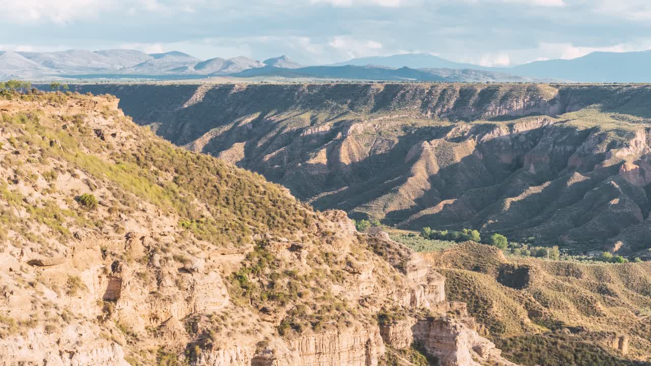 Cloud shadow moving over Gorafe desert landscape