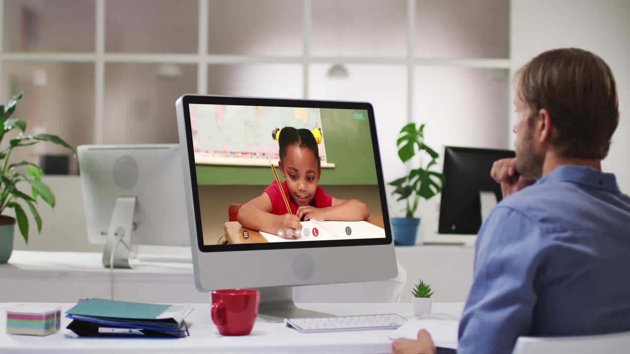 Caucasian male teacher using computer on video call with schoolgirl