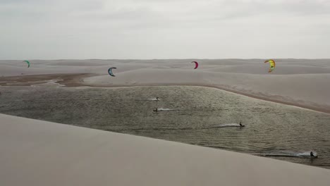 kitesurfing in a small lake in the famous dunes of lencois maranhenses