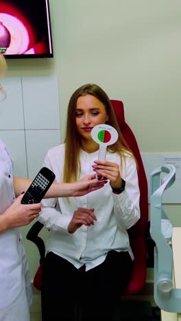 optometrist optician doctor examines patient