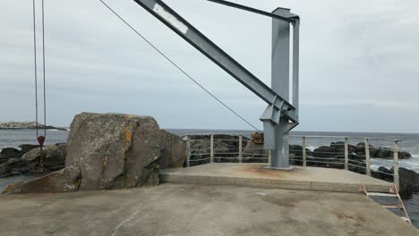 Old-Crane-Used-to-Move-Boats-On-and-Off-the-Sea-in-Kråkenes,-Norway