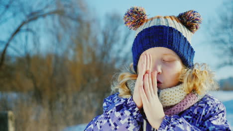 girl 5 years enjoys winter - throws snow 2