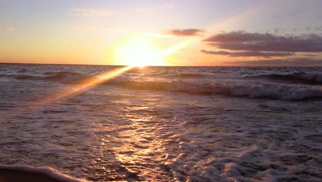 beautiful autumn sunset and waves in the sea