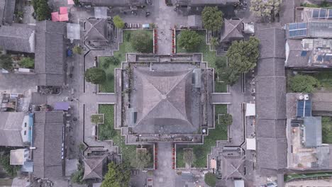 top-down aerial footage of the wu hua tower in dali's ancient city