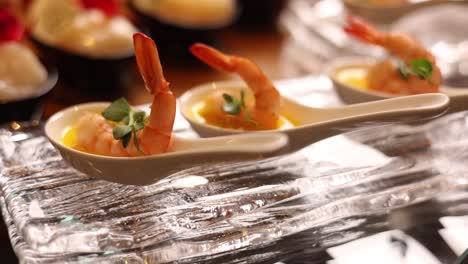 shrimp appetizers on spoons