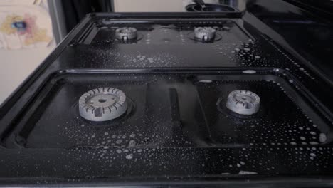 oven cleaning and scrubbing